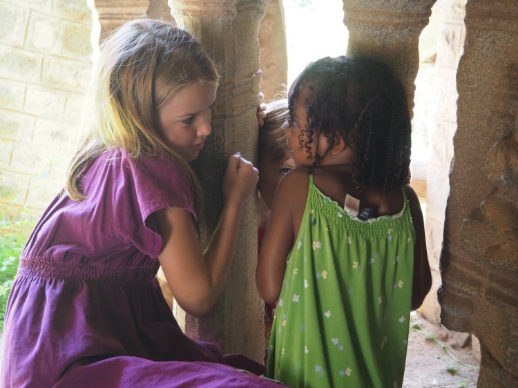 Listening to the amazing musical pillars in an Ancient Hampi temple