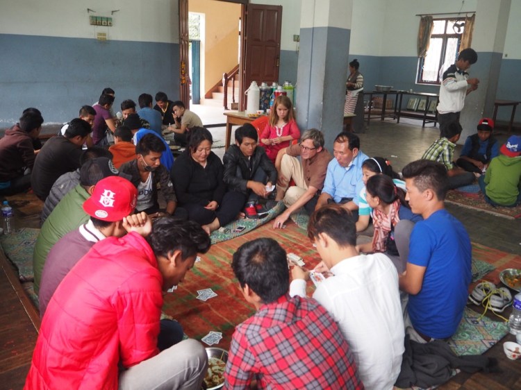 Playing cards at Karma's community festival celebrations - my knees really struggle to sit of the floor for any length of time!
