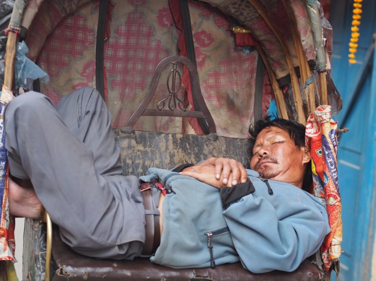 A rickshaw driver taking a well-earned rest!