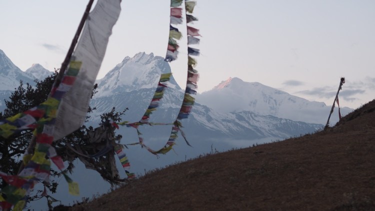 the ubiquitous prayer flags flapping in the wind