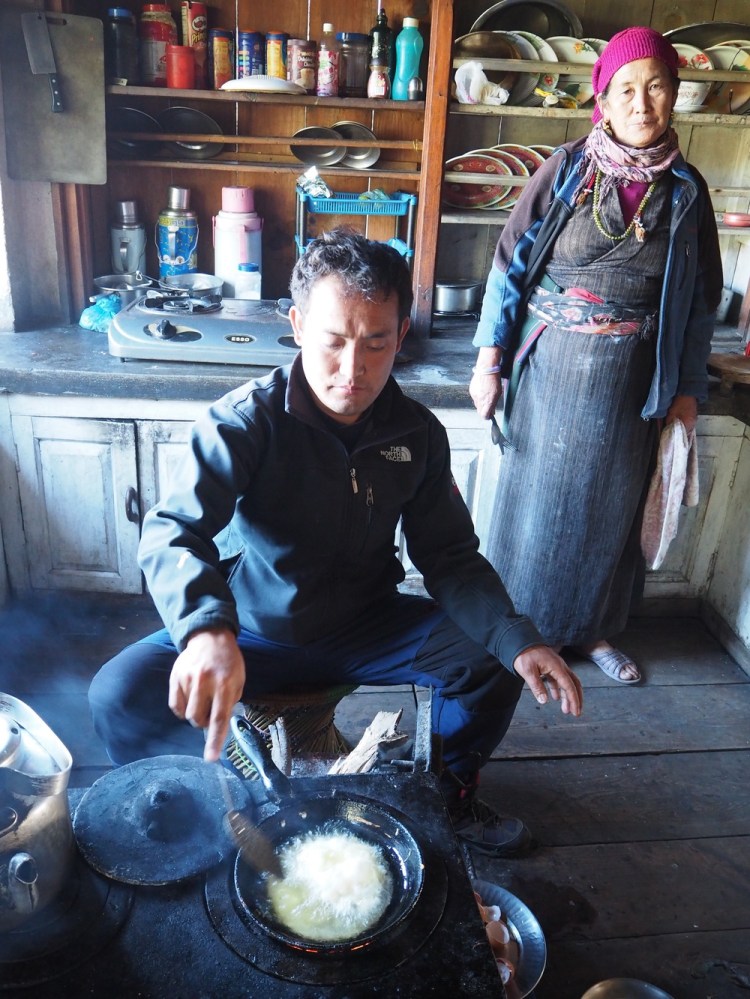 Karma makes us apple pie - deep fried and delicious and surprisingly un greasy - his mum looks on!