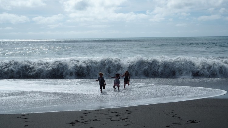 Running from the waves at Punakaki