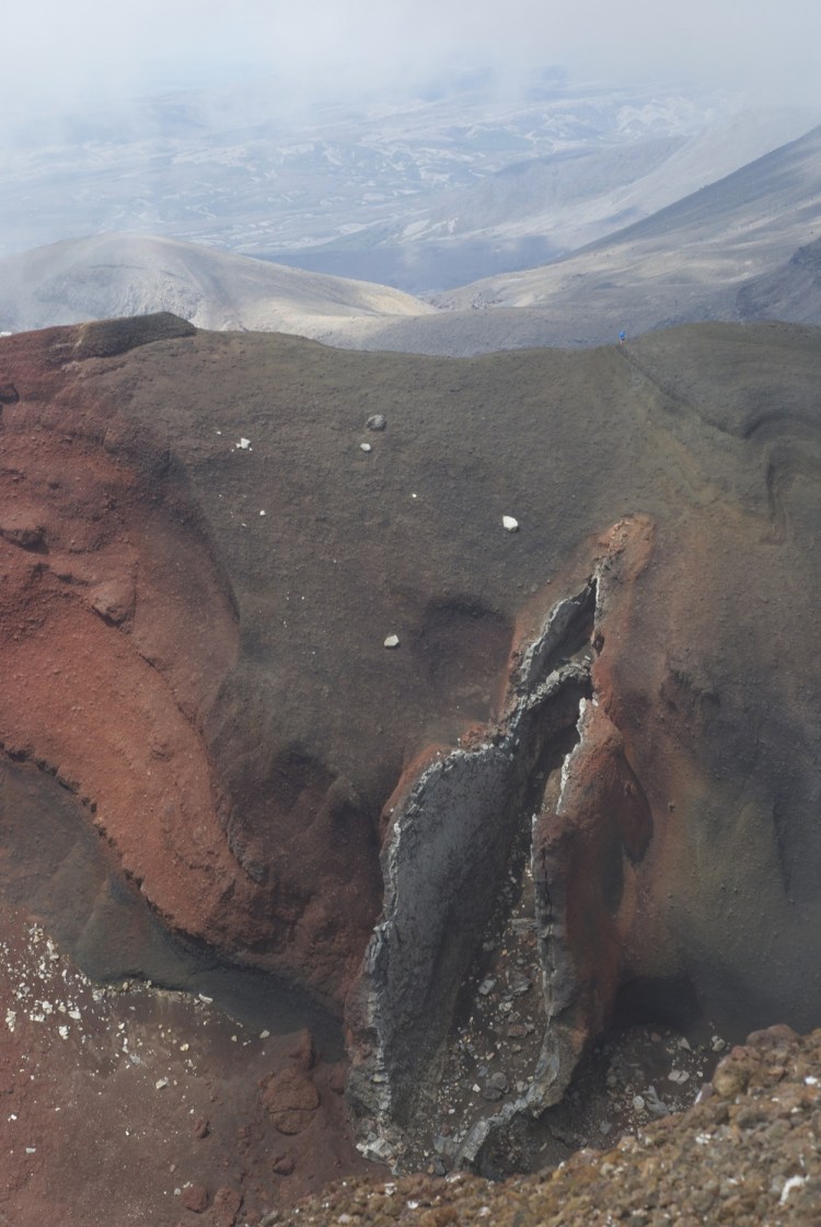 One of the many dramatic views on the Tongariro crossing - note the person on the ridge for scale. Once Toby had suggested this looked like a certain part of the mountain's anatomy, I couldn't look at it any other way!&nbsp; (Copyright Toby Gee) 