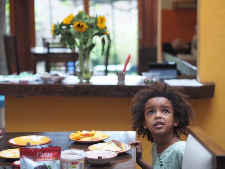 Inside the house . Millie is sitting at the table which would have been the courtyard.