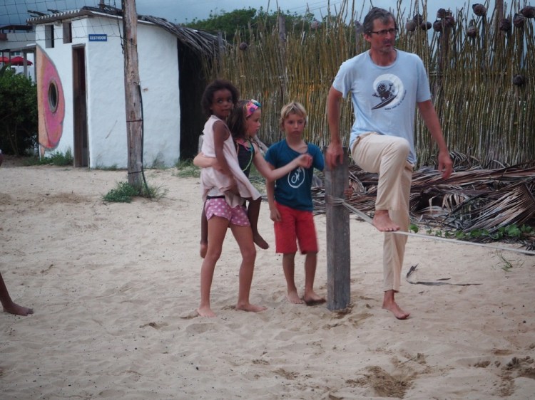 It's my turn at slack lining. We're definitely getting one of these in our garden when we get home! 