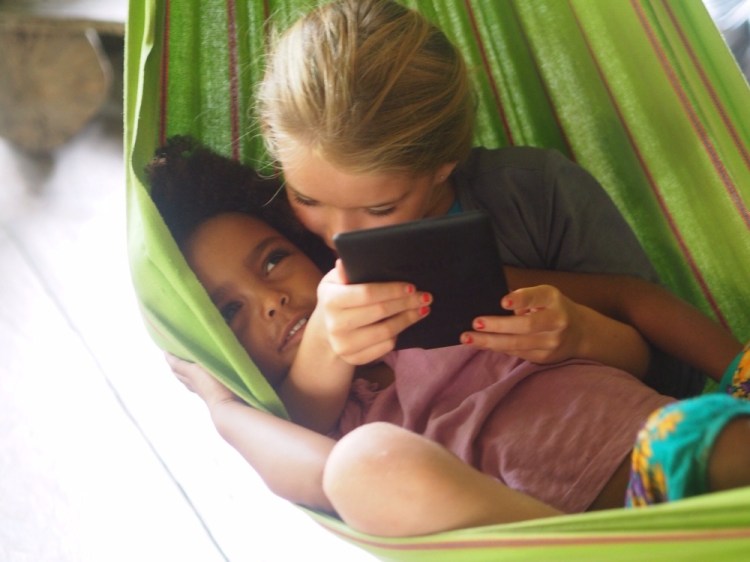 A few precious moments in a hammock, Jemima is reading The Witche to M and G