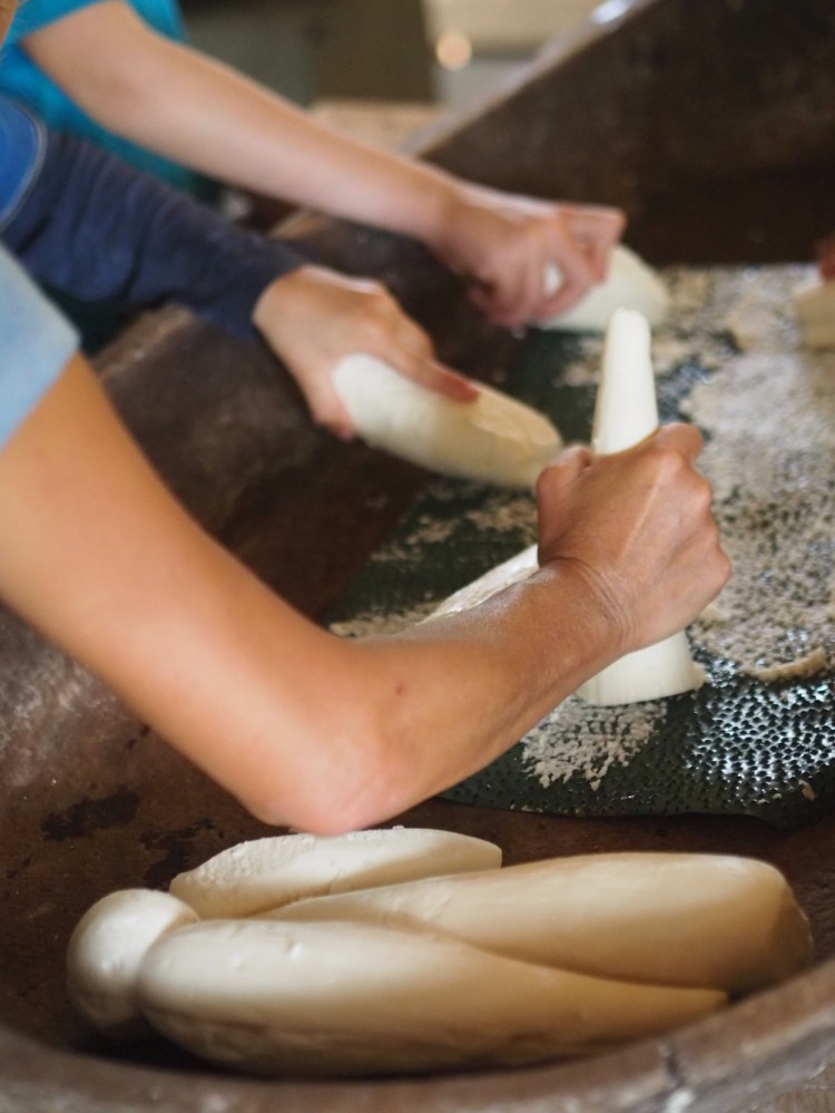 Helping to make yucca bread