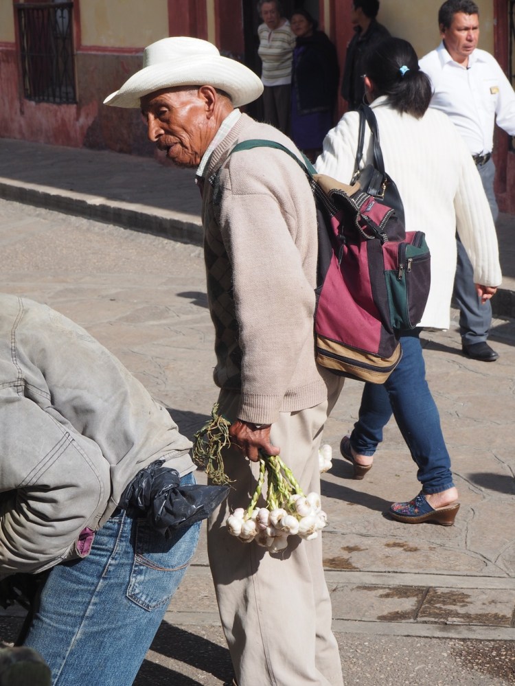 Selling garlic on the street is no way for a man of this age to be making a living - it's the harsh reality of life here, though.  