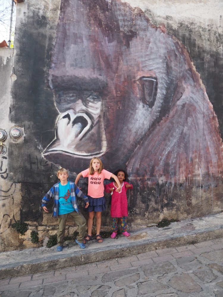 A bow to the vast gorilla on the way out . He sits on the wall opposite