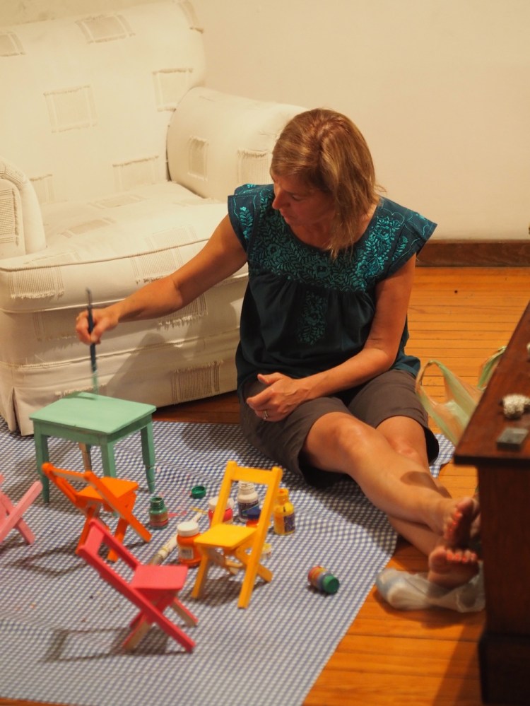 Mum painting tables and chairs for barbie. To Millie on her birthday